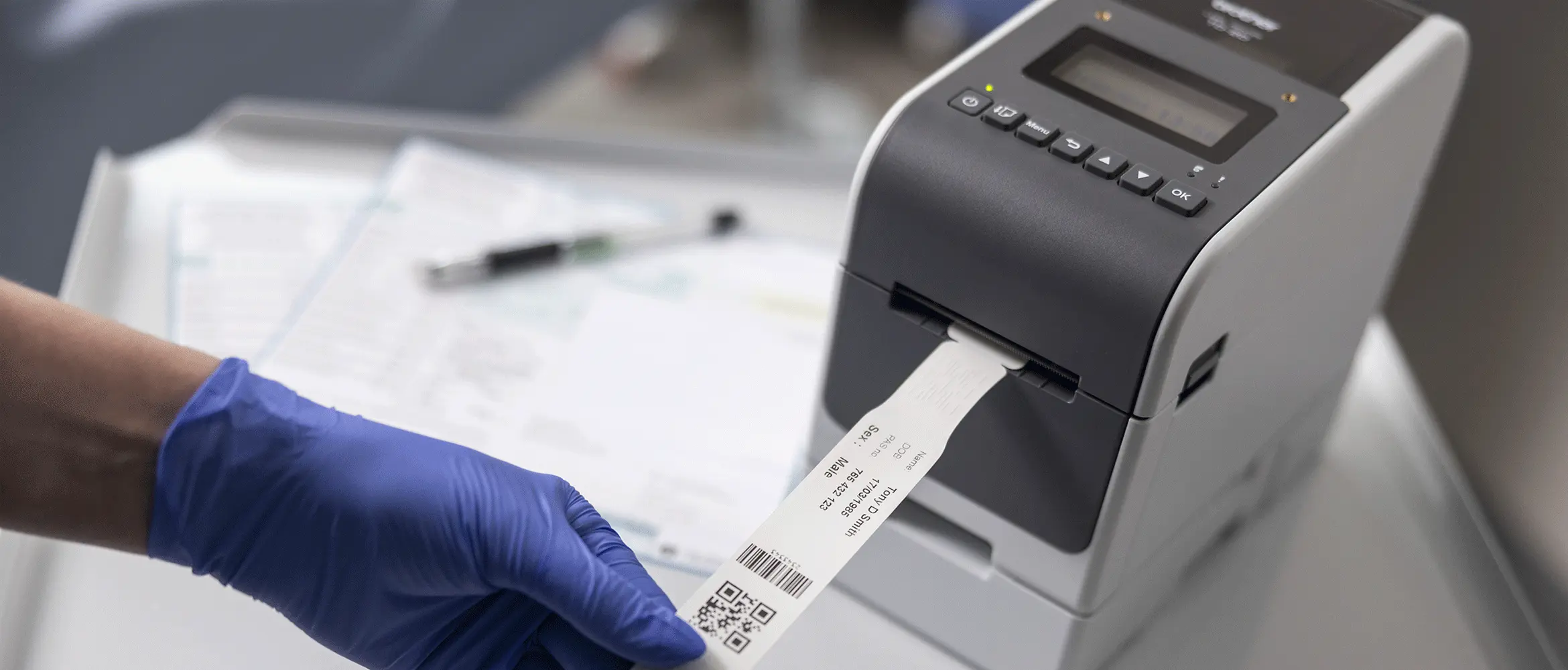 <p>Nurse printing wristband from TD-2 label printer</p>