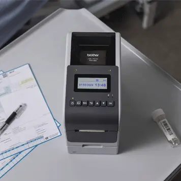 <p>TD-2 Label Printer on desk on hospital ward </p>