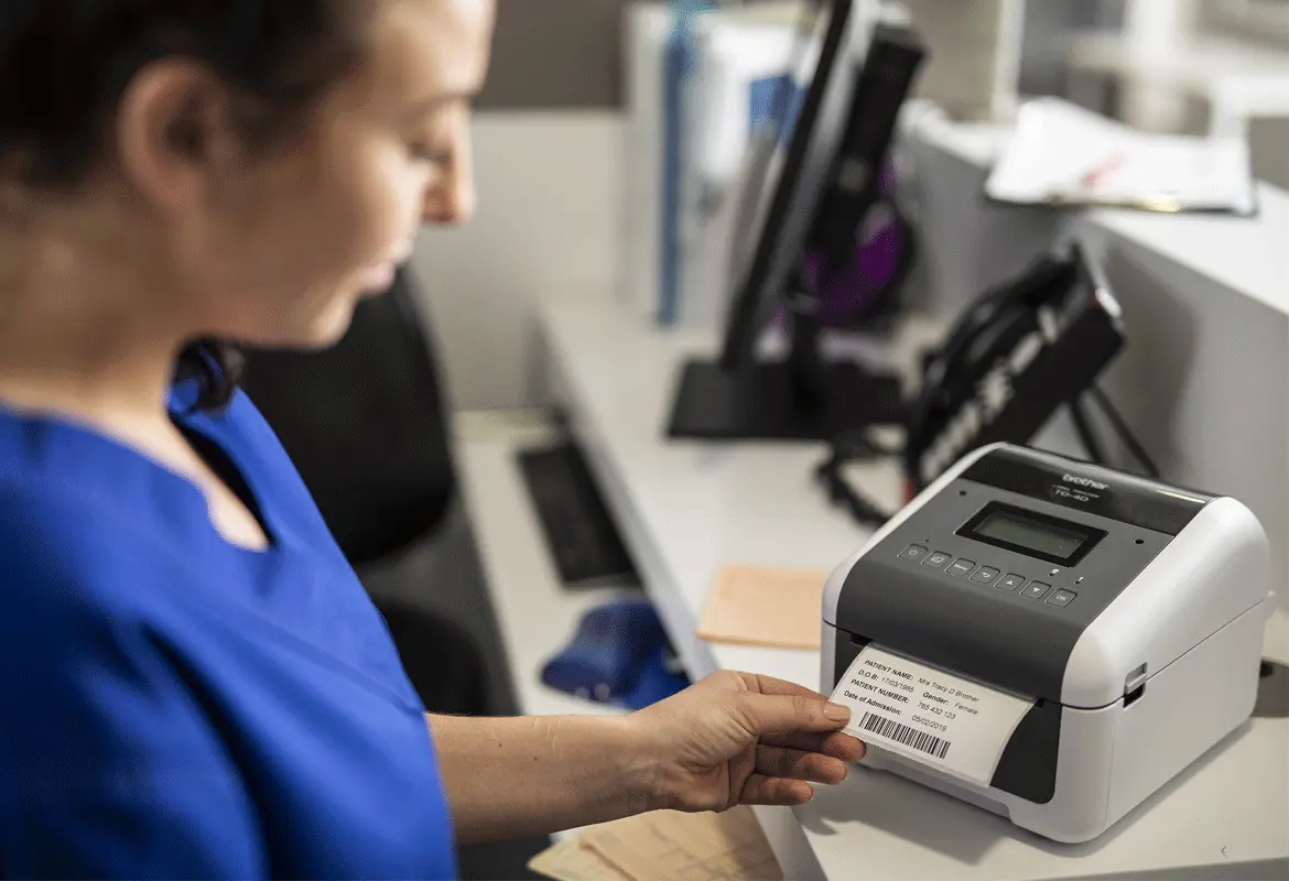 <p>Nurse printing out label using td-4000 label printer</p>